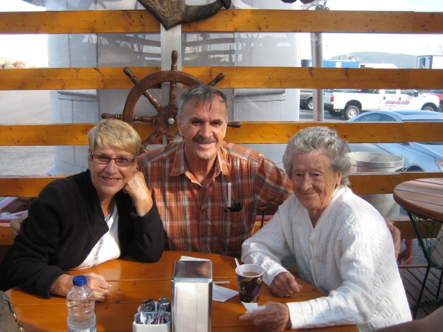 Brother and sisters (Marie-Anne, Andre, Alexina) at the Casse-Croûte on the wharf in Sept-Îles, Quebec